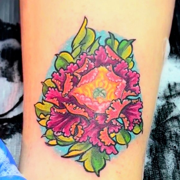 Vivid colour peony flower tattoo in pink, orange and green with a teal background, by Seamus at Fat Bastard Tattoo, Parksville BC